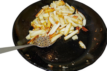 potatoes on the iron frying pan