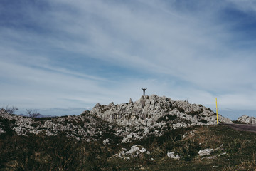 Climber on top of mountain freedom and happiness in nature 