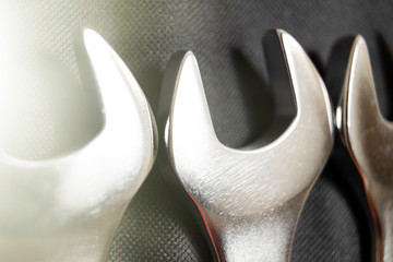 Macrophotography of a set of spanners on a dark background. Toned
