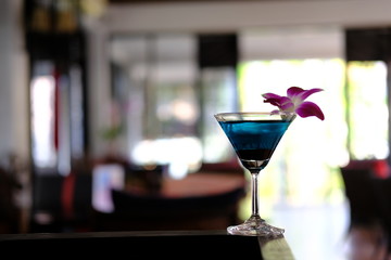 glass of blue martini cocktail
