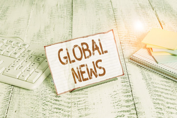 Handwriting text writing Global News. Conceptual photo world noteworthy information about recent or...