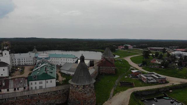 A slow flight near the towers (&ldquo;Spinning&rdquo; and &ldquo;White&rdquo; towers) of the Solovetsky Kremlin on a cloudy day with soft lighting. This is part of the fortress of the Solovetsky monastery (1420)