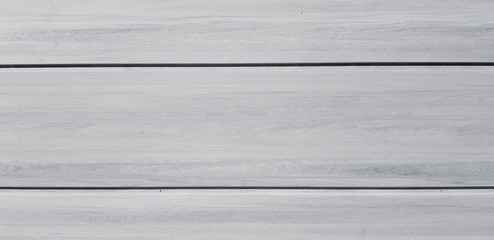 Gray or grey wooden background with copy space in the middle or center. Surface material and Hardwood 