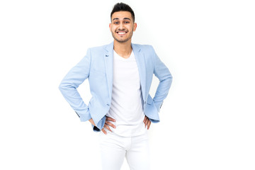 Fototapeta premium young man in a blue jacket stands on a white background with copy space
