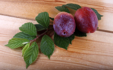 Plums on table