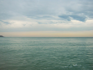 Seascape in cloudy or warm summer weather, surf wave. The concept of peace, tourism, excitement, relaxation and vacation.