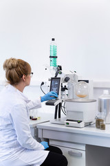 Chemist extracting cbd with rotavapor in laboratory