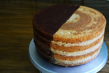  stuffed cake without covering in apparent layers, half black and half white ready for decoration