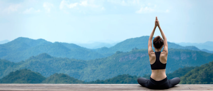 Lifestyle woman yoga exercise and pose for healthy life. Young girl or people pose balance body vital zen and meditation for workout nature mountain background in morning day. Copy space for banner. 