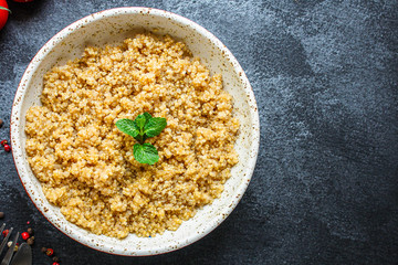 Cooked quinoa, boiled cereal porridge (healthy diet eating) menu concept background. top view. copy space for text