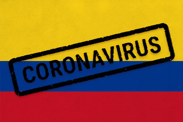 Flag of Colombia on paper texture with stamp, banner of Coronavirus name on it. 2019 - 2020 Novel Coronavirus (2019-nCoV) concept, for an outbreak occurs in the Colombia.