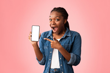 Excited African Lady Showing Phone Blank Screen Over Pink Background