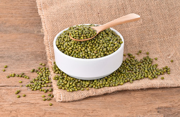 Mung beans and spoon on a wooden