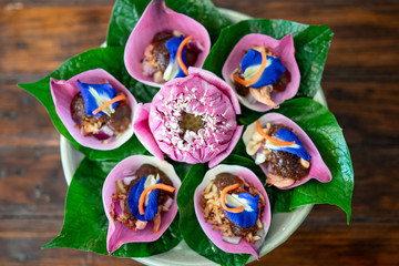 Thai Food-Miang Kham Petal of Lotus Flower Wraps with sauce Thai ancient dish.