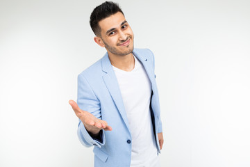 business man in a blue classic jacket holds out his hands on a white background with copy space