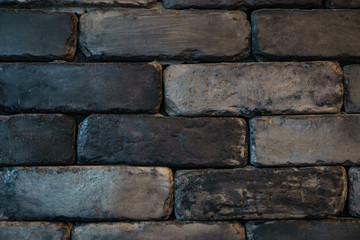 black brick wall texture, black brick wall surface.