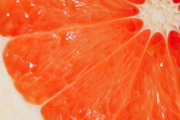 juicy fresh ripe grapefruit in a section close-up, macro