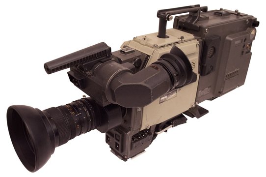 Old reporter television camera isolated on white.