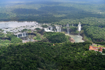 Fototapeta na wymiar roaring waterfalls in the wild jungle from a helicopter