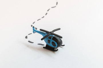 Small colorful helicopter toys isolated on a white background - air travel by helicopter concept