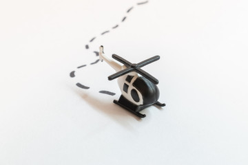 Small colorful helicopter toys isolated on a white background - air travel by helicopter concept