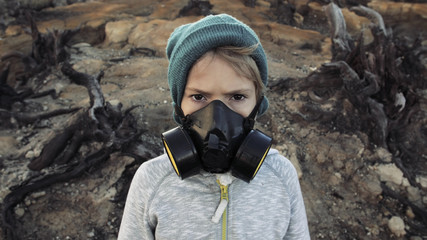 Environmental pollution, ecological disaster, nuclear war, post apocalypse concept. Child in...
