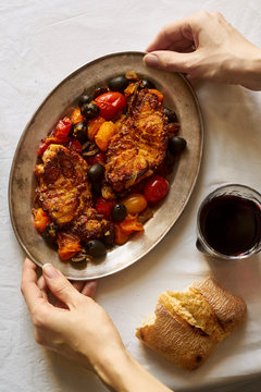 Roasted white fish with cherry tomatoes, lemon rind and olives