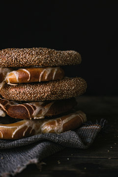 German Bread Pretzel and Bagel Breakfast on a wooden table. Black Background