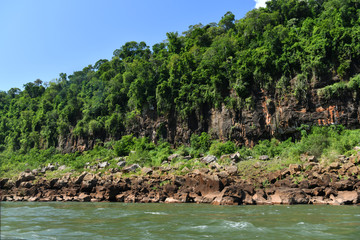 a trip to the roaring waterfalls on the river in a motor boat in a national park in brazil