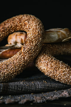 Macro Bread Pretzel and Bagel on a wooden table