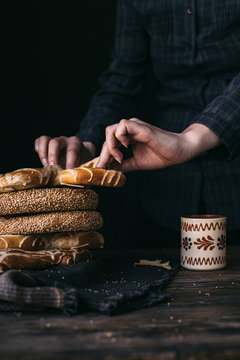 German Bread Pretzel and Bagel Breakfast on a wooden table. Black Background.