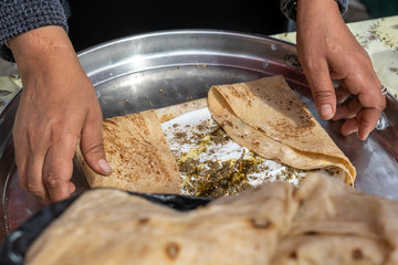 Homemade arabian flatbread (other names is pita, lavash, lafa, parantha, roti, chapati) with olive...