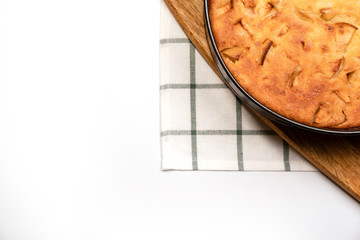 fragment of homemade cake in pan on wooden Board. 