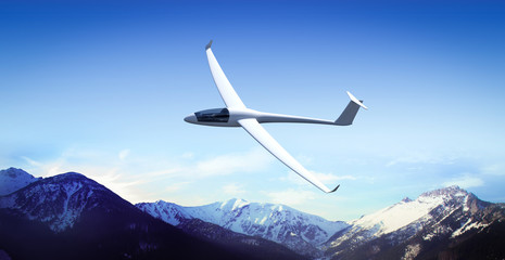 The glider is flying in the mountains - obrazy, fototapety, plakaty