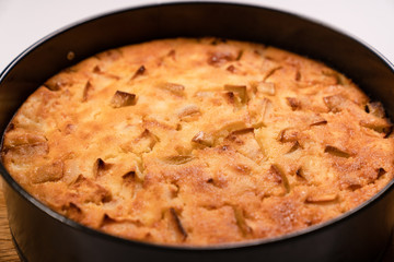 homemade cake in pan on wooden Board. 