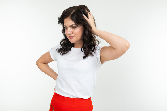 pensive girl in white t-shirt isolated on a white studio background