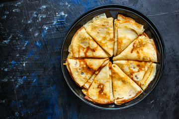 crepes Tasty dessert (thin pancakes, healthy breakfast) menu concept. background. top view. copy space for text
