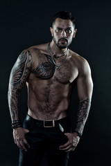 Fototapeta na wymiar Muscular Man. Beautiful male torso. sexy athletic guy has naked body. sportsman with tattoo on strong body. bodybuilding and sport nutrition. protein and steroids effect. healthy dieting for fit body