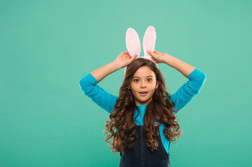 Hope and innocence. Little child celebrate Easter. Small child in Easter style. Cute look of bunny child. Girl child wear long rabbit ears. Spring season. Holiday celebration