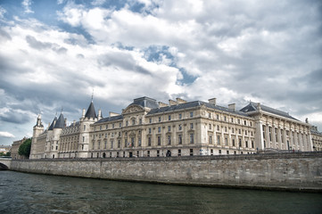 Fototapeta na wymiar Place of interest. Palace at embankment. Palace building river view. Old palace in paris france. Palace residence on cloudy sky. Architecture and structure. Historical monument. Travel destination