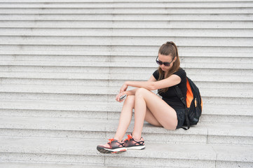 Waiting. Urban space. Tourist guide sightseeing. Vacation ideas. Vacation in big city. Woman relaxing. Museum university building. Girl student sit stairs. Explore city. Vacation and travel concept