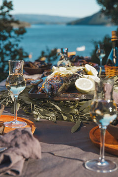 Table With Seafood - Fish And Mussels, White Wine With Sea On Background