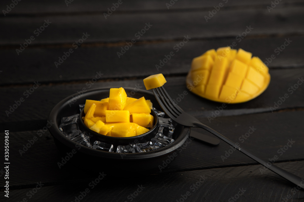 Poster delicious mango fruit cut into squares