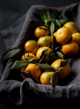 Fresh Tangerines with Leaves Ion grey linen napkin