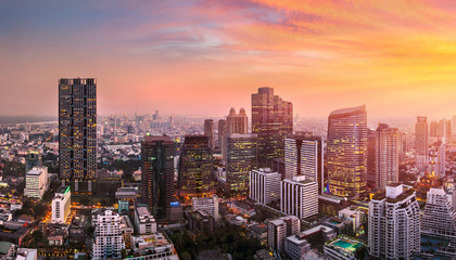 Fototapeta na wymiar sunset rooftop view bangkok city office buildings tower, hotel and living, condominium in bangkok city skyline top view Downtown and business office bank financial in capital city of thailand asian