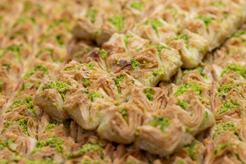 Baklawa (baklawa) Traditional and authentic Middle Eastern Arabian pastry, fried dough leaves, honey, in the shape of an open square. Stuffed with pistachios. Mahane Yehuda Market, Jerusalem.