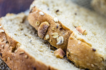 homemade vegan bread with nuts, chestnuts, oats and flaxseed. Healthy life and diet concept.