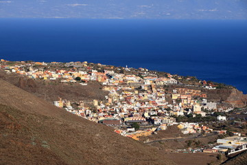 Fototapeta na wymiar General view of San Sebastian de la Gomera with Teide Volcano (in Tenerife Island) in the background, La Gomera, Spain