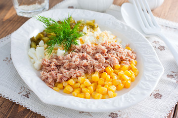 Salad with canned tuna and corn, selective focus