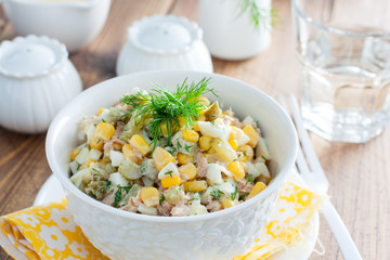 Salad with canned tuna and corn, selective focus